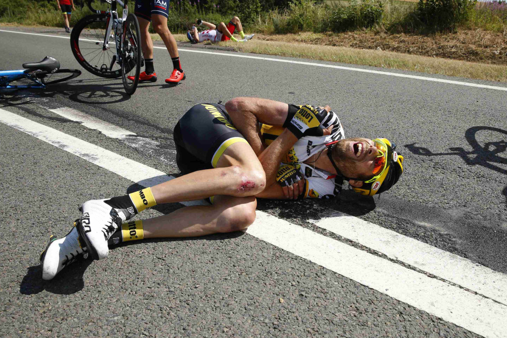 Lotto-Jumbo rider Laurens ten Dam of the Netherlands lies on the ground after a fall during the third stage of the 102nd Tour de France cycling race from Anvers to Huy
